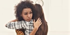 Two women hugging to support each other